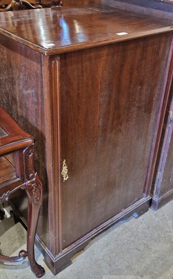 Lot 934 - A mahogany cupboard opening to fitted interior...