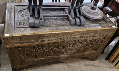 Lot 950 - A Chinese camphor wood blanket box, carved in...