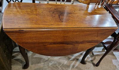 Lot 951 - A George III mahogany drop-leaf dining table,...