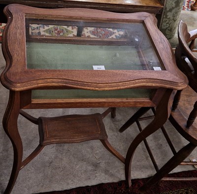 Lot 968 - An early 20th century oak bijouterie table...