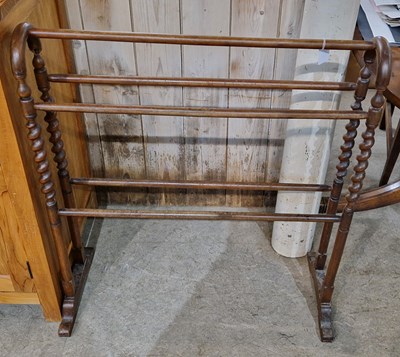 Lot 976 - A 19th century mahogany towel rail with spiral...