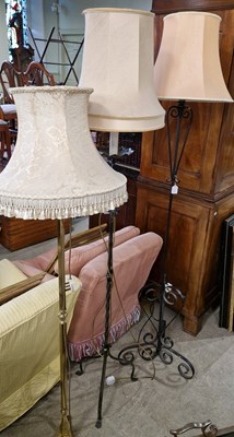 Lot 990 - Three assorted standard lamps and shades.