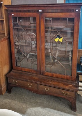 Lot 993 - A mahogany bookcase, the upper section with...