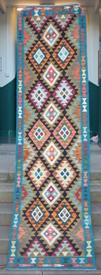 Lot 1004 - A Maimana Kilim runner, the black ground...