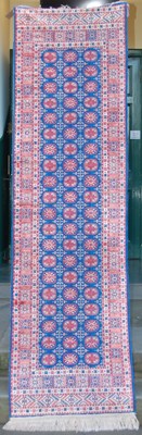 Lot 1008 - A blue ground Persian style runner, decorated...