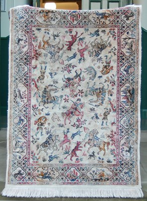 Lot 1013 - Two silk rugs, one decorated with rectangular...