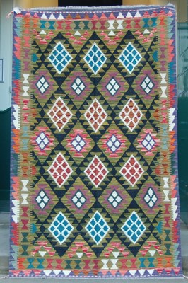 Lot 1015 - A Maimana Kilim, the black ground decorated...