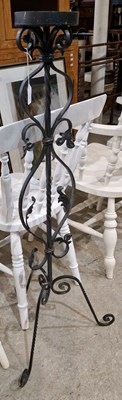 Lot 994 - A wrought iron candlestand, 110cm high.