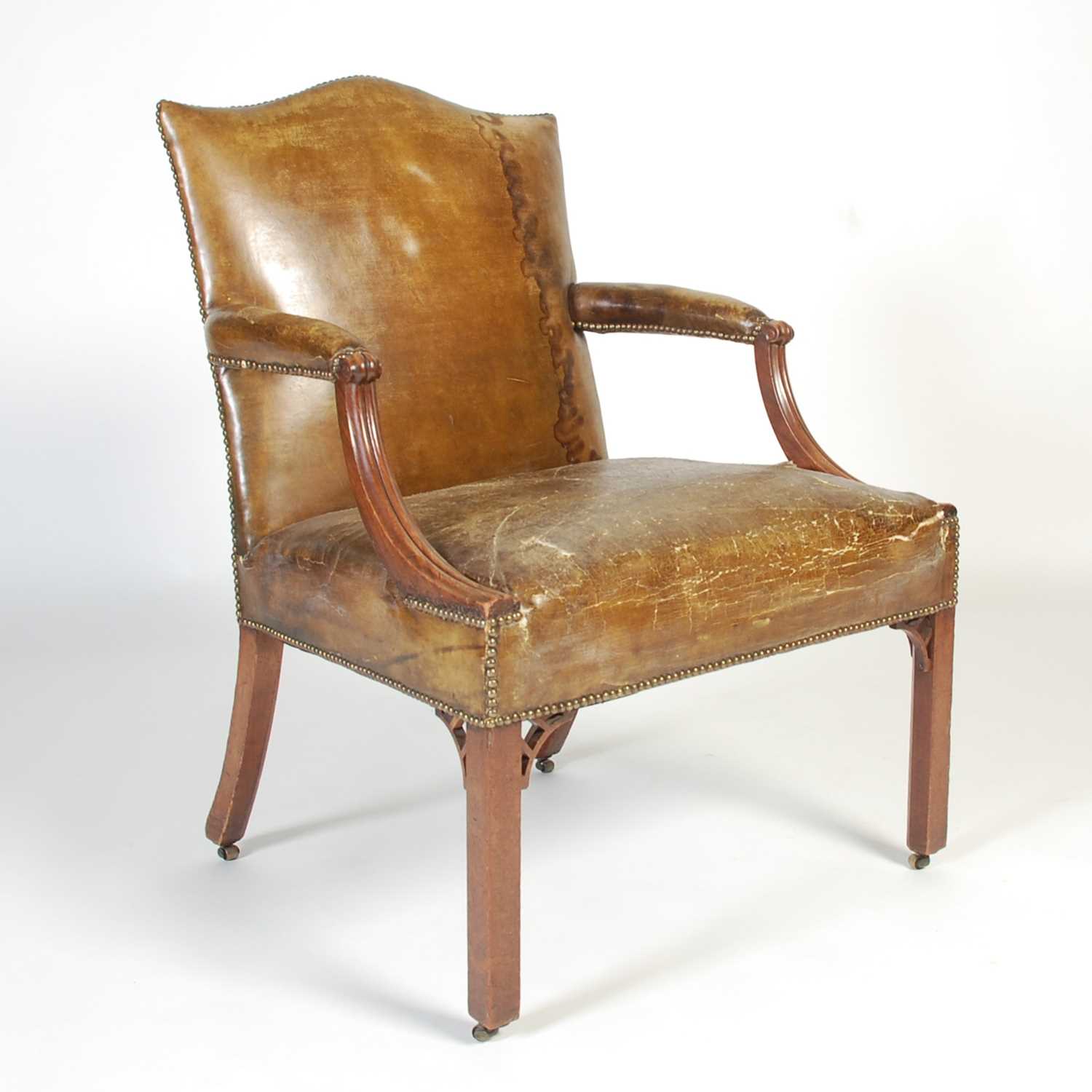 Lot 90 - A George III mahogany Gainsborough chair, the...