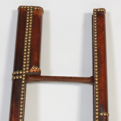 Lot 15 - A mahogany, leather and brass studded folding...