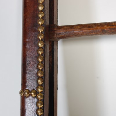 Lot 15 - A mahogany, leather and brass studded folding...