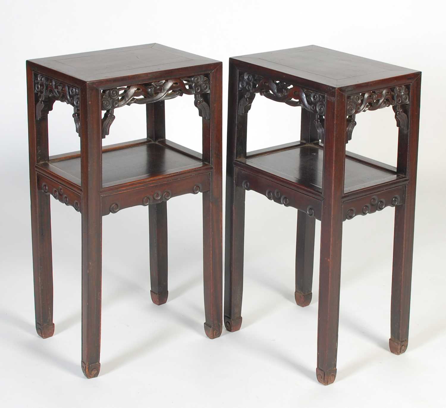 Lot 7 - A pair of Chinese darkwood urn stands, late...