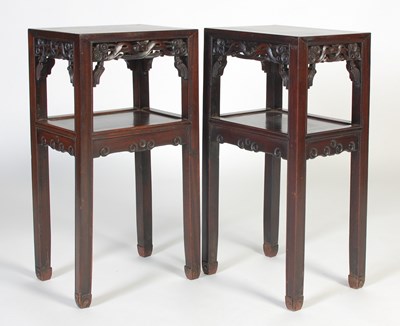 Lot 7 - A pair of Chinese darkwood urn stands, late...