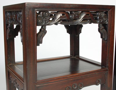 Lot 7 - A pair of Chinese darkwood urn stands, late...