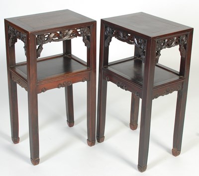 Lot 7 - A pair of Chinese darkwood urn stands, late...