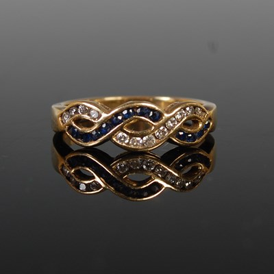 Lot 38 - An 18ct gold, sapphire and diamond dress ring,...