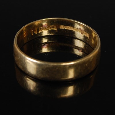Lot 46 - An 18ct gold wedding ring, inscribed 'Lucky'...