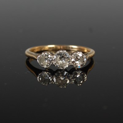 Lot 47 - A yellow and white metal three stone diamond...