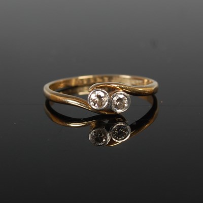 Lot 63 - A yellow and white metal two stone diamond...