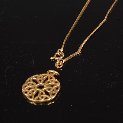 Lot 70 - A 9ct gold Celtic style circular pendant on...