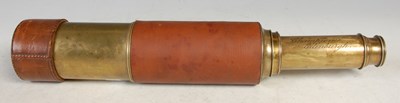 Lot 110 - A brown leather bound brass telescope by...