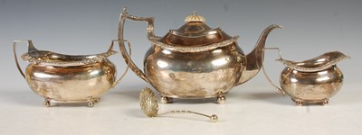 Lot 121 - An antique three piece London silver tea set,...