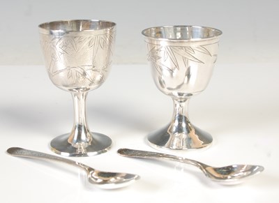 Lot 135 - A pair of Chinese sterling silver egg cups and...