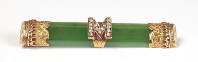 Lot 271 - A yellow metal mounted green stone bar brooch,...