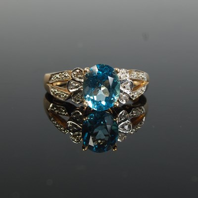 Lot 285 - A yellow metal, topaz and diamond chip dress...