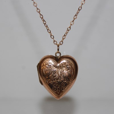 Lot 296 - A gold plated heart shaped pendant, suspended...