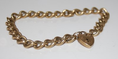 Lot 301 - A 9ct gold bracelet with 9ct gold heart shaped...