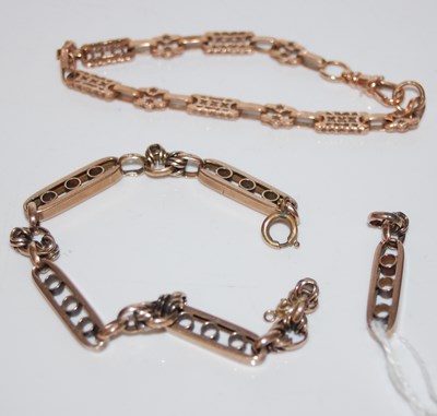 Lot 313 - A 9ct gold fancy-link bracelet, with one loose...
