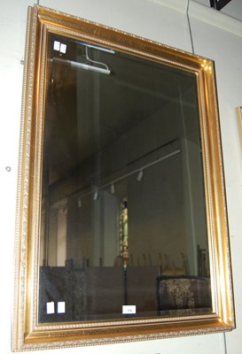 Lot 776 - A gilt framed rectangular bevelled wall mirror.