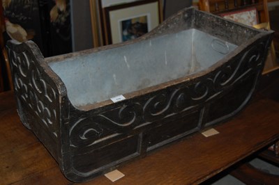 Lot 778 - An antique carved wooden childs cot with metal...