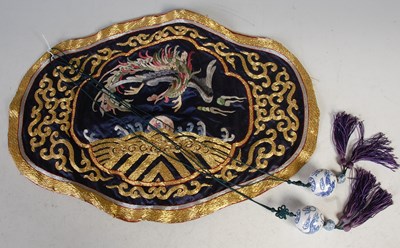 Lot 389 - A Chinese blue ground silkwork panel depicting...