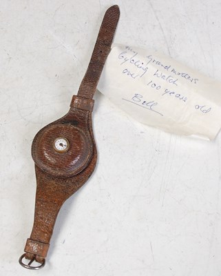 Lot 324 - A vintage brown leather mounted cycling watch,...