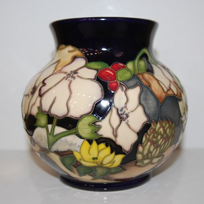 Lot 327 - A modern Moorcroft blue ground pottery vase,...