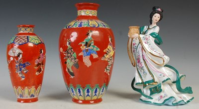 Lot 409 - A Japanese red ground porcelain vase, late...