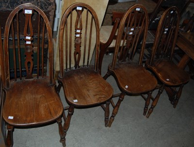 Lot 787 - A set of four 20th century elm Windsor style...