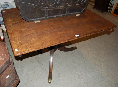 Lot 790 - A 19th century oak snap-top table, the turned...