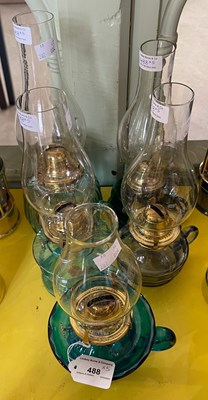 Lot 488 - Five assorted oil burning paraffin lamps, four...
