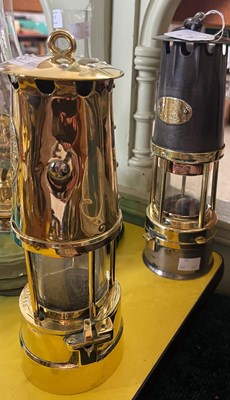 Lot 489 - A copper and brass Protector Lamp & Lighting...