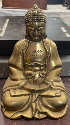Lot 515 - A gilt metal figure of Buddha, late 19th/...