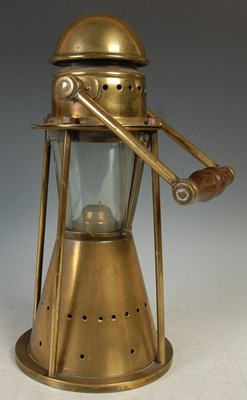 Lot 541 - An unusual brass marine candle lamp by Bulpitt...