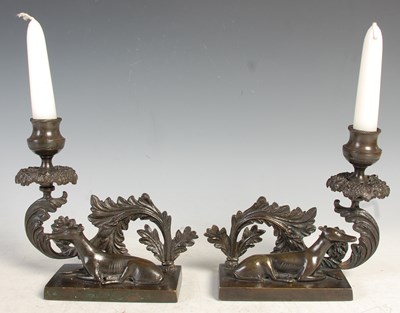 Lot 551 - A pair of 19th century bronze candle stands,...