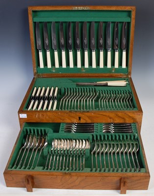 Lot 557 - An oak cased Art Deco style canteen of cutlery...