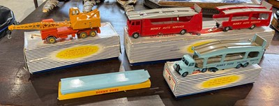 Lot 558 - A collection of four boxed vintage Dinky Toys...