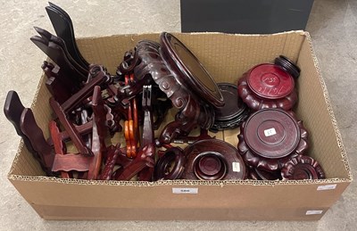 Lot 586 - Box - assorted carved wood stands, plate...