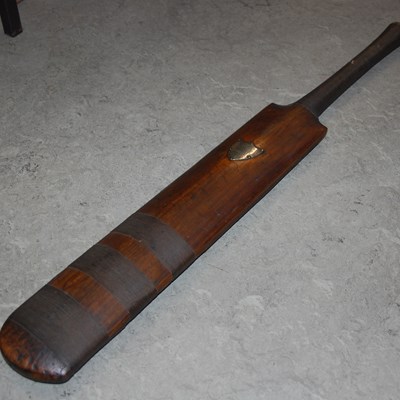 Lot 607 - A 19th century London made cricket bat with...