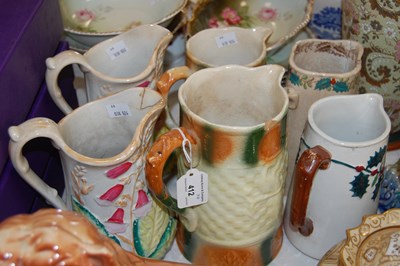 Lot 412 - A collection of six Scottish pottery jugs to...